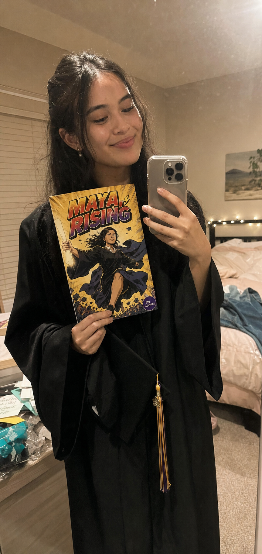 Maya P. with their printed graduation comic